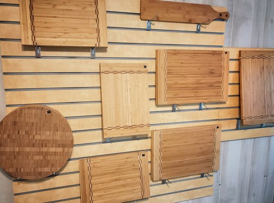 Bamboo cutting boards on hand for personalization