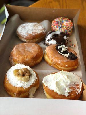 The best paczkis! Chocolate cream, strawberry cream, banana cream, lemon cream w/ cream cheese frosting, cookies & cream.