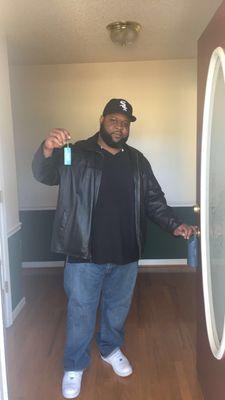 First time homebuyer with keys to his house.