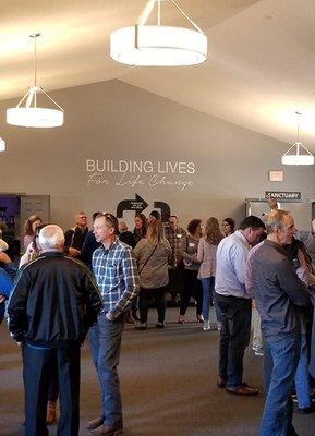 Church mingling before service in the lobby