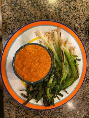 Grilled green onions with an amazing hazelnut romesco