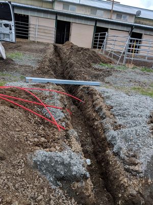 Ditch for water, power, septic for mobile home.