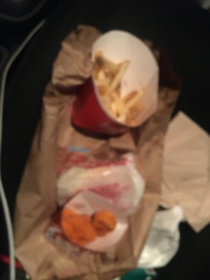 4 PC. Spicy Chicken Nuggets, French Fries a spicy nuggets that I didn't order and some cold ass fries