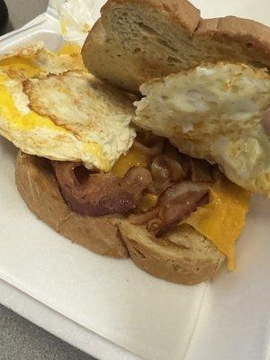 Breakfast Sandwich: 2 eggs, cheddar cheese, bacon, Rye Bread