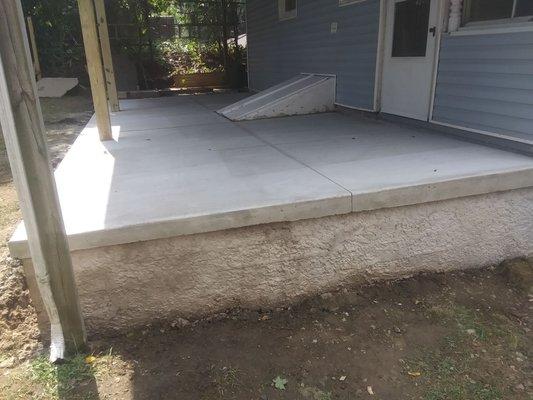 Monolithic concrete solid porch stucco finish