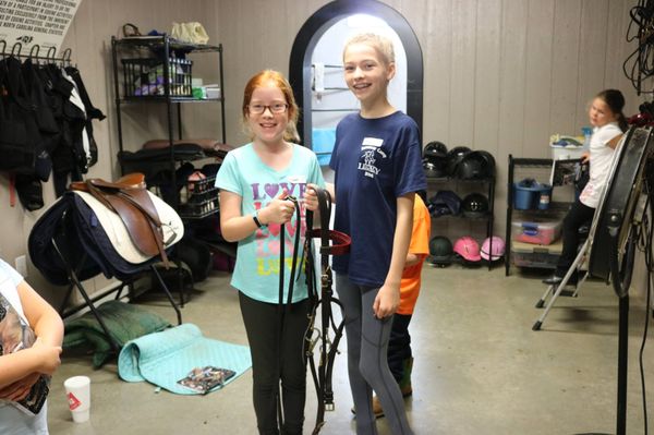 Legacy students enjoy learning more about the horses. Camps and our award-winning youth club are great ways to get involved