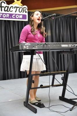 My daughter sings her solo.