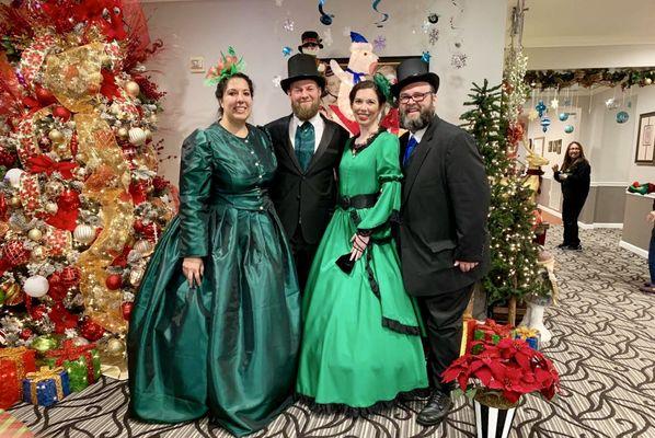 The Victorian Vocalists - Classic, Victorian attire. Gorgeous gowns, tops hats and a nod to the Dickensian Era.