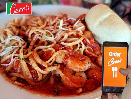 Seafood Arrabiata - 
Succulent shrimp and scallops in a spicy red 
sauce served over linguini.