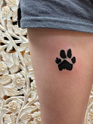 paw print tattoo by sandy