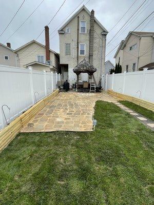 Sod and stone patio installation