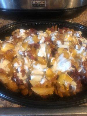 Bacon cheddar waffle fries drenched with ranch dressing prepared by Ms.JuJu