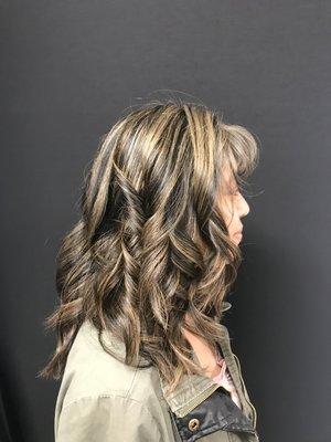 Women's highlight On thick hair with layers and beach waves