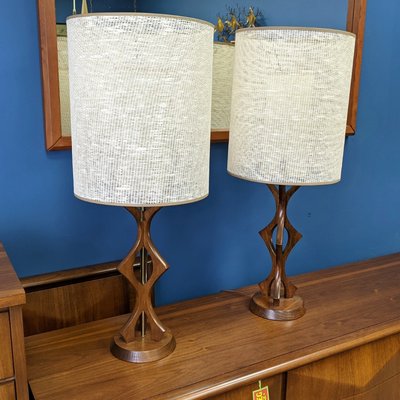 Pair of Mid-Century Modern sculpted walnut table lamps