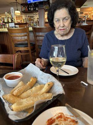 Italian fries=fried dough, grated Parmesan, marinara. This is my gorgeous Mom/Dr. Barbara Keller of Upper Arlington.