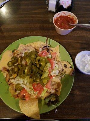 Chicken fajita nachos with queso instead of shredded cheese.  5 stars!