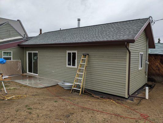 Exterior of first floor with french door and patio.