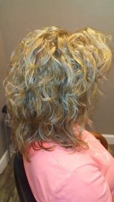 The same client with the beautiful color and cut straight hair in the previous,  This is after the beautiful perm I gave her.