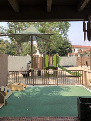 Toddler's playground structure and the infant room's outside yard.