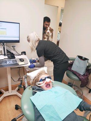 Dental Treatment on a Pediatric Patient featuring a "photo-bomb" from our service dog Lassi.