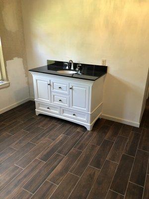 New vanity and tile flooring