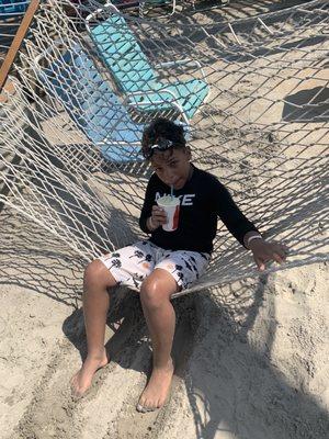 My son on the hammock enjoying a virgin Pina colada