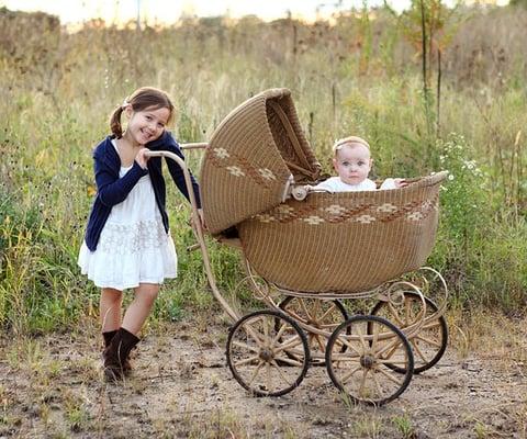 Little girls and a baby buggy