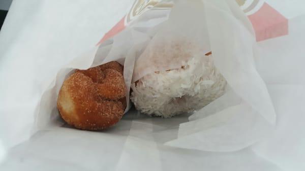 Sugared cinnamon twist of the left, coconut iced donut on the right.