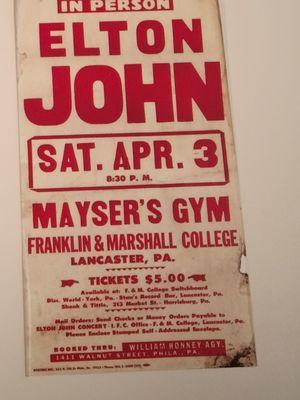 Located in the Musuem: Elton John Concert poster with sound by the group from lancaster!