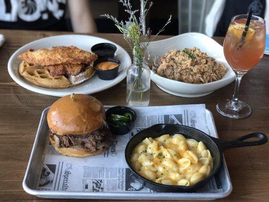 Chicken & waffles, beef brisket sandwich with a side of Mac n cheese, and shrimp jambalaya + Ashland cocktail