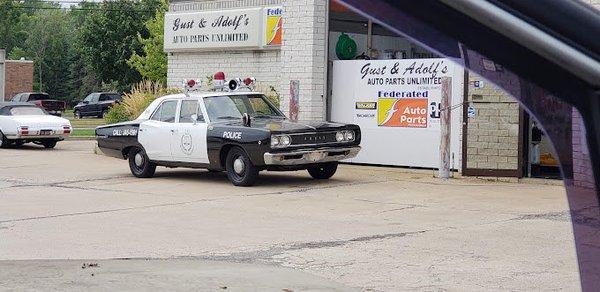 Oldschool cop car in front of Gust & Adolf's.