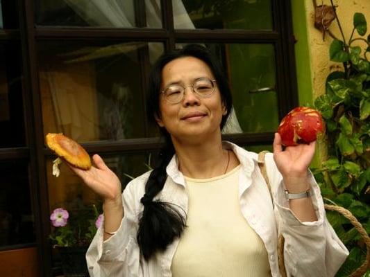 Business Owner, Barbara, with colorful mushrooms at Oaxaca Market in Mexico