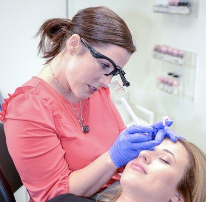 Tamsen performing a microblading service. Private Studio located inside Sola salons in Eden Prairie