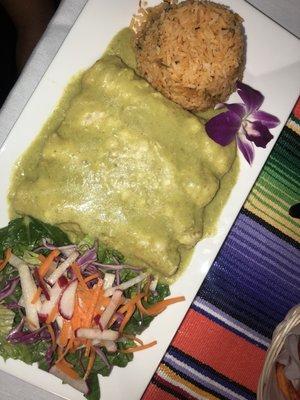 Chicken enchiladas in green sauce. Not sure what green sauce is but it's delicious lol