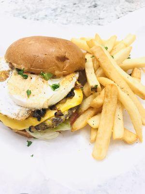 Fried Egg cheeseburger and caramelizad onion with french fries