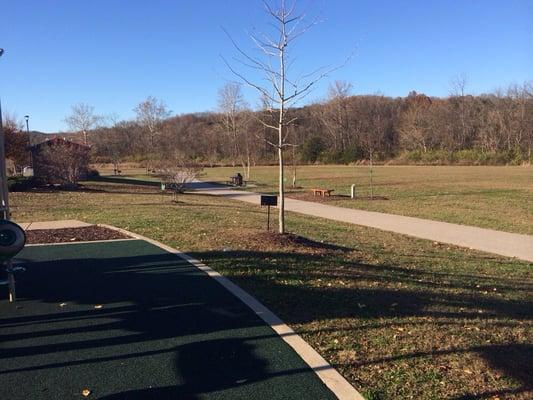 Part if the walking path circling the grassy area for playing.