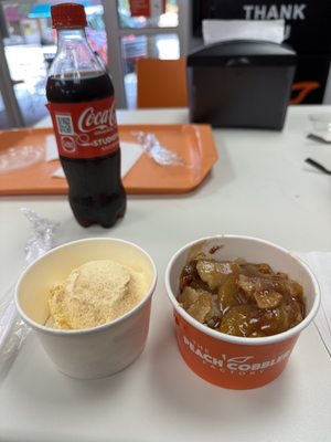 Peach cobbler & ice cream in separate cups.