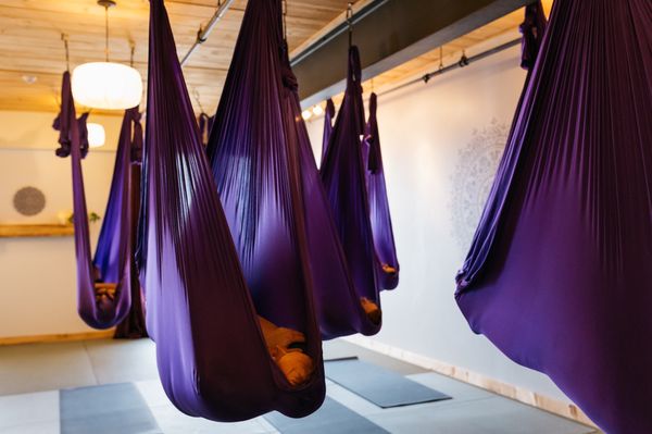 Savasana gets an upgrade with the supporting and nurturing aerial hammock.