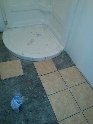 New shower base kit and tiled bathroom floors