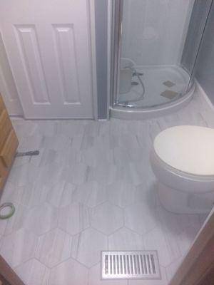 Hexagon Porcelain Tile, Corner Shower with Sliding Curved Glass.