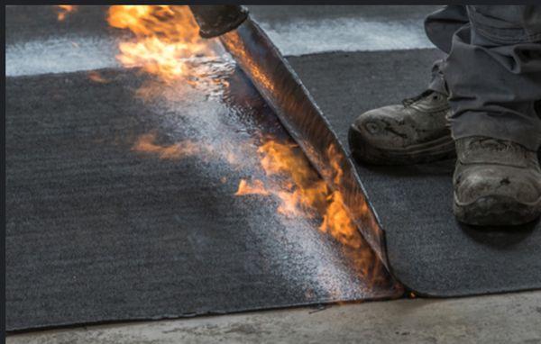 Torch down being applied onto Roof