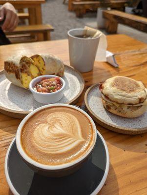 breakfast burrito, the one- handed, flat white, tea.