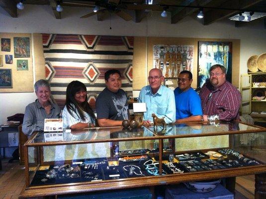 Some Zuni carvers and customers who have visited.