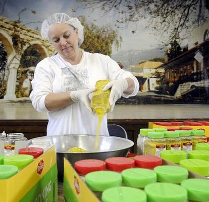 Volunteer prepares dessert for the festival!