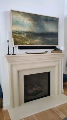 Over fireplace frame TV with custom bezel