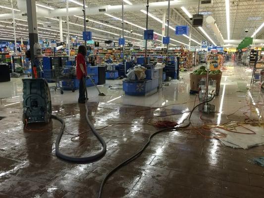 Extracting water from the Troy, AL Walmart after a tornado collapsed part of the roof.