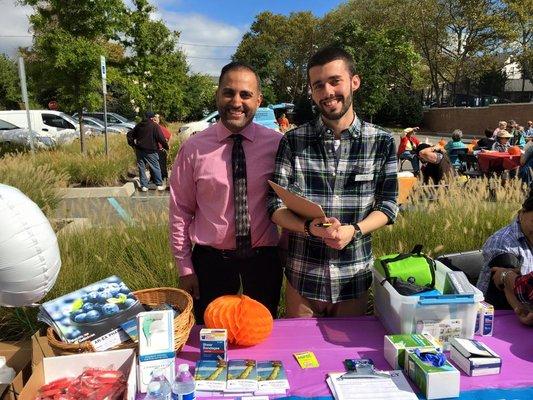 Our front-store manager Paul with pharmacist Anil at one of our many outreach programs!