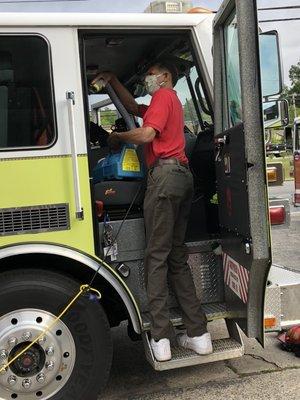 John Mayes disinfecting trucks with VitalOxide for the Rome-Floyd County Fire Department