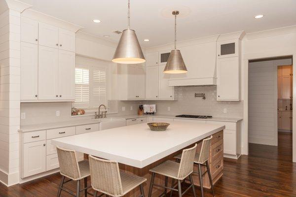 Custom quartz stone countertop offers durability paired with timeless elegance.