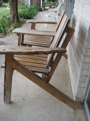 Chairs along the front of the motel allow for watching the sunset over the lake.